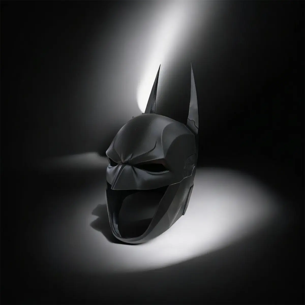 Black 3D printed superhero inspired display helmet with detailed finish