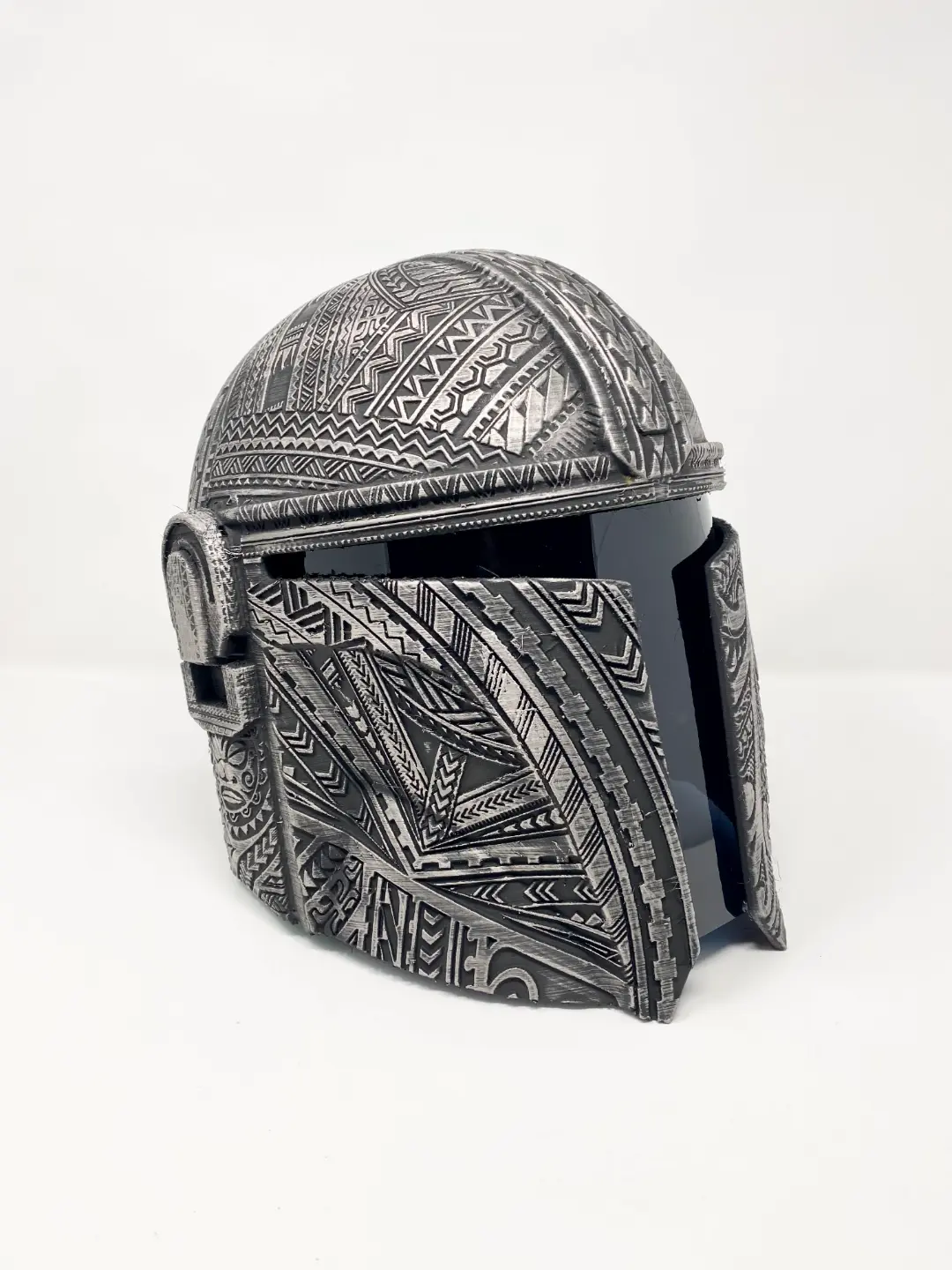 Detailed silver 3D printed Mandalorian inspired helmet for cosplay and display