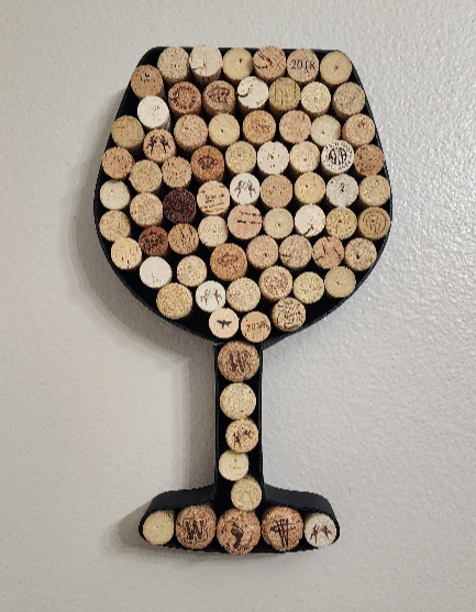 Wine glass shaped wine cork holder for displaying collected corks